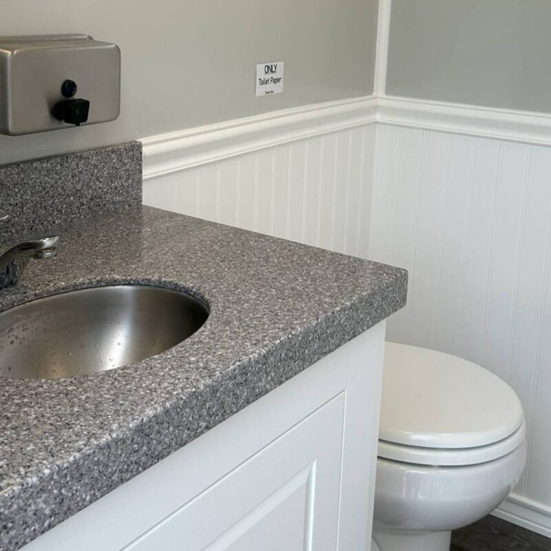 counter toilet inside washroom trailer rental