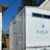 parked portable bathroom outside at night