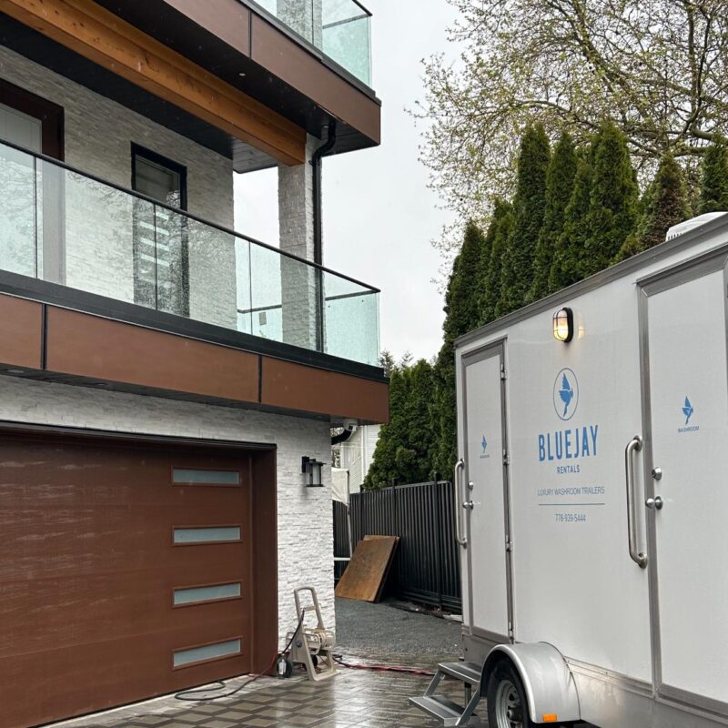 double portable bathroom trailer outside house private party