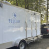 washroom trailer being parked in place after measured