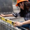 women measuring at construction site in Vancouver BC