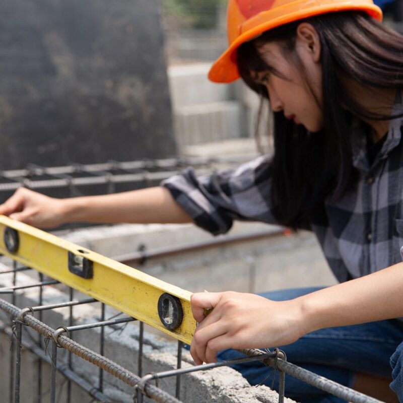 women measuring at construction site in Vancouver BC
