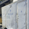 portable washroom trailer outside construction site